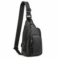 Sac bandoulière 18 x 8 x 32 cm en similicuir noir avec poches zippées